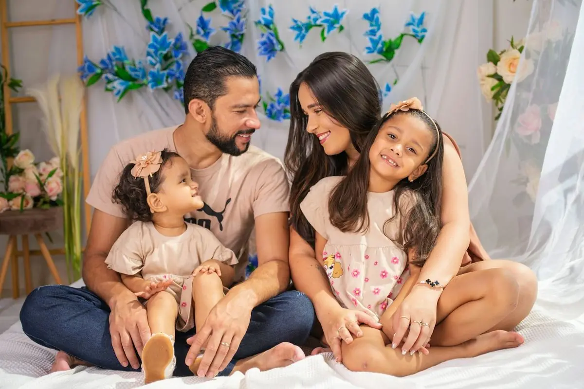 Indian family of four sitting together at home